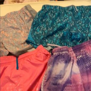 Four pair of Nike dri-fit shorts